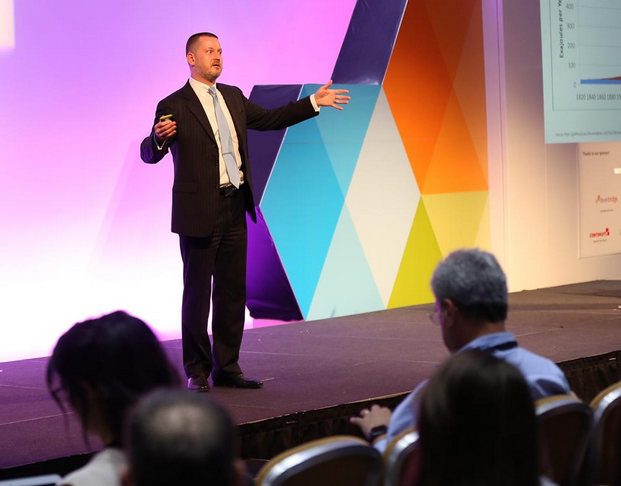 Dr. Ulrich Winkler speaking on stage